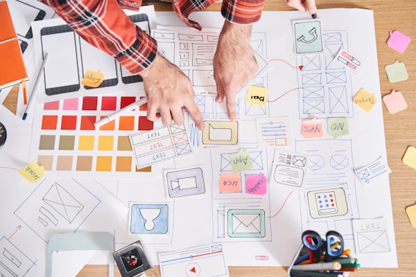 Marketing sketches and content planning notes on a desk